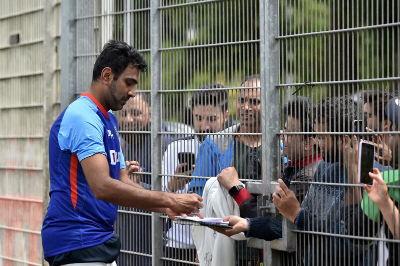 India's Ravichandran Ashwin signs autographs for fans after attending a training session at Edgbaston. AP 