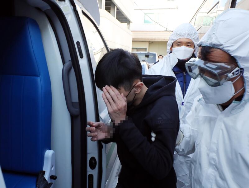 A Taiwanese national jailed in South Korea is taken to a hospital by health officials after complaining of symptoms of the novel coronavirus at a police station in Gwangju, South Korea. The man tested negative for the virus. EPA