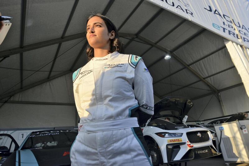 Saudi Arabia's first female race driver Reema al-Juffali poses in front of her car during an interview with AFP in Diriyah district in Riyadh on November 20, 2019, ahead of the international Jaguar I-PACE eTROPHY series for electric zero-emission cars set for the weekend. (Photo by FAYEZ NURELDINE / AFP)