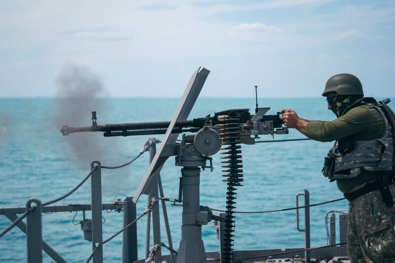 A special forces serviceman fires a weapon aboard the Romanian Navy's 'King Ferdinand5' frigate during military exercises in the Black Sea, near Constanta, Romania. Bloomberg