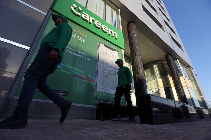 FILE PHOTO: Careem employees walk past the company headquarters in Dubai, UAE December 13, 2018. Picture taken December 13, 2018. REUTERS/Satish Kumar/File Photo