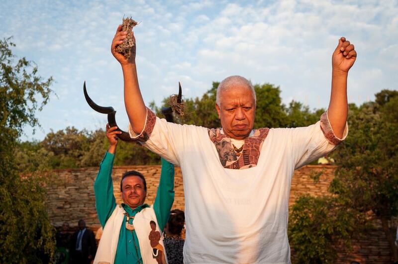 Members of the Khoe and San tribe pray. Stefan Heunis / AFP Photo