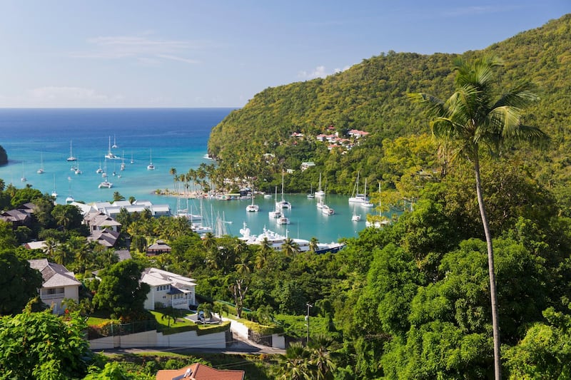 View over the village and harbour to the Caribbean Sea, Marigot Bay, Castries, St. Lucia, Windward Islands, Lesser Antilles, West Indies, Caribbean, Central America. Getty Images