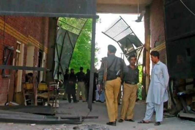 The damaged main entrance of the prison in Bannu yesterday has raised questions about intelligence and security lapses.