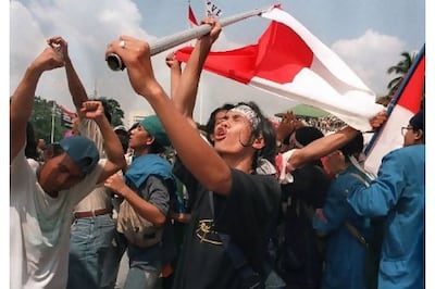 Students celebrate the resignation of Indonesian President Suharto at the parliamentary complex in Jakarta in 1998. Kemal Jufri / AFP