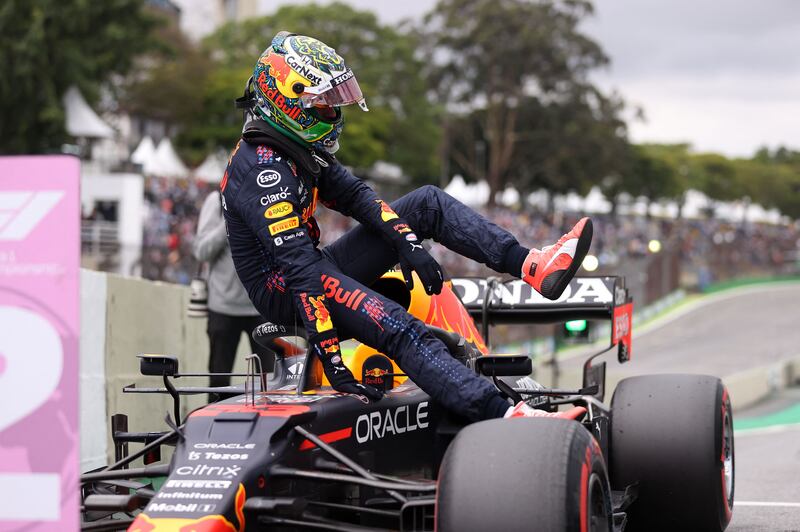 Max Verstappen has been fined for touching Lewis Hamilton's car following the Brazilian Grand Prix qualifying. AFP