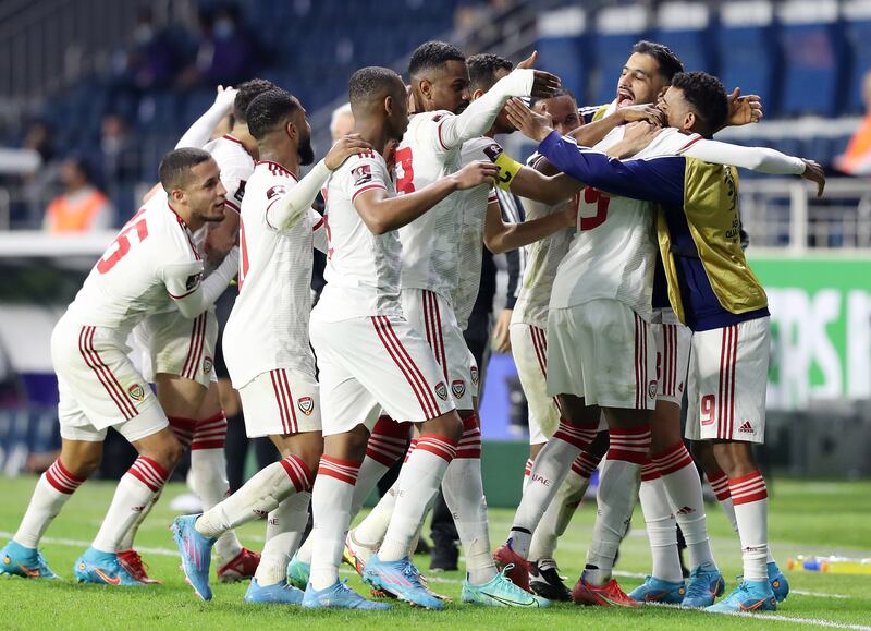 Yahya Al Ghassani celebrates with teammates after scoring for UAE. Chris Whiteoak / The National