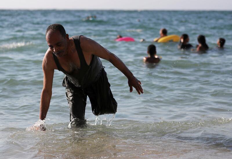 Mohamed, 54, after a swim at the beach for people with disabilities in Alexandria.