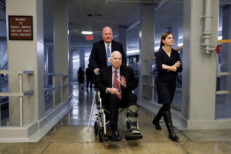 Sen. John McCain heads to the Senate floor ahead of votes on Capitol Hill in Washington, U.S., December 6, 2017. REUTERS/Aaron P. Bernstein