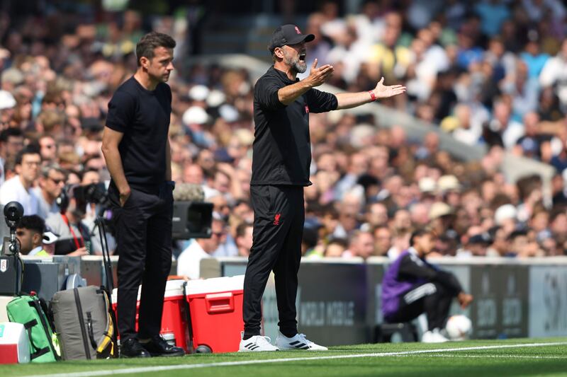 Fulham coach Marco Silva, left, and Liverpool manager Jurgen Klopp watch the action. AP