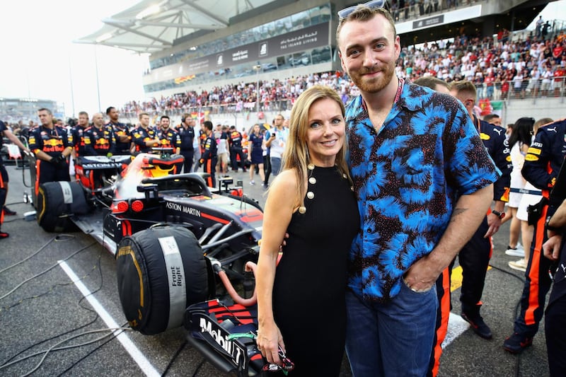 Geri Horner and Sam Smith pose for a photo with the Red Bull Racing team on the grid before the Abu Dhabi Formula One Grand Prix. Getty
