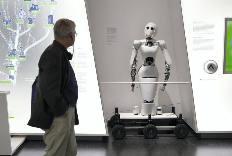 BERLIN, GERMANY - AUGUST 27: A visitor looks at an AILA (Artificial Intelligence Lightweight Android) robot during a press preview at the new Futurium museum in the city center on August 27, 2019 in Berlin, Germany. The museum, which will open to the public on September 5, asks how humanity will live in the future and seeks answers through exhibits, many of them interactive, that draw on nature, architecture, robotics, artificial intelligence, science and other fields. (Photo by Sean Gallup/Getty Images)