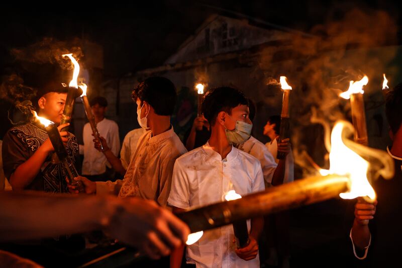 Youths hold torches at a parade to welcome the holy month in Jakarta, Indonesia. EPA