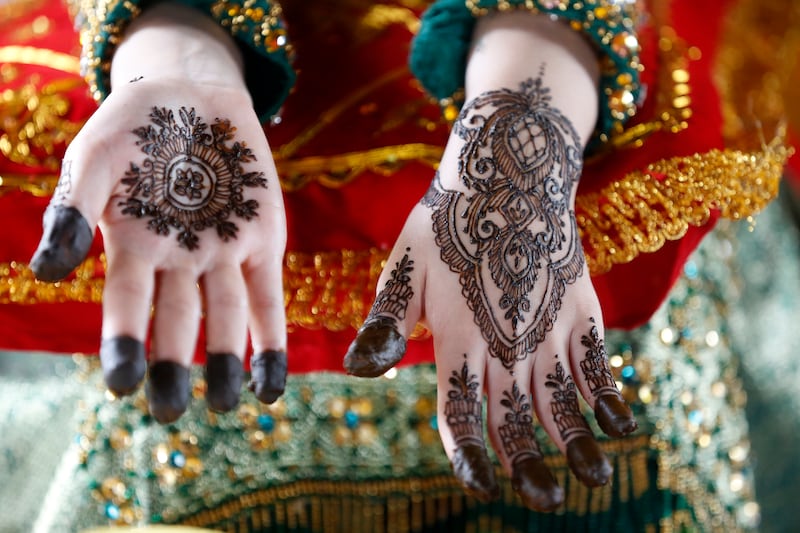 A model displays henna tattoo designs on her hands during a competition in Banda Aceh, Indonesia. EPA