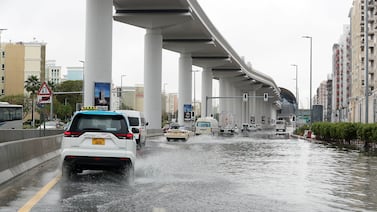 Traffic on the water logged road around Discovery Gardens and Al Furjan area in Dubai. Pawan Singh / The National