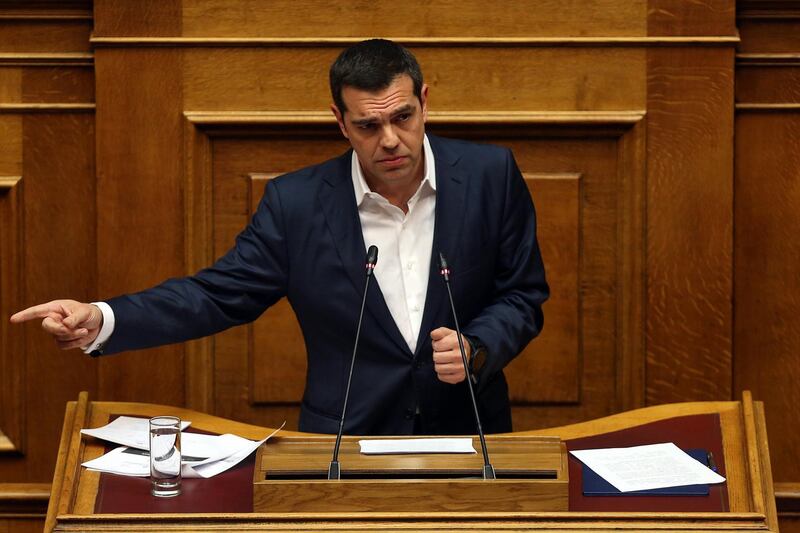 epa06551625 Greek Prime Minister Alexis Tsipras  speaks during a debate in the plenary session of the Parliament in Athens, Greece, 21 February 2018. The Parliament debates prior to a vote late at night on whether two former prime ministers and another eight former ministers should be investigated by a preliminary committee for liability in the Novartis alleged bribery and money laundering case  EPA/ORESTIS PANAGIOTOU
