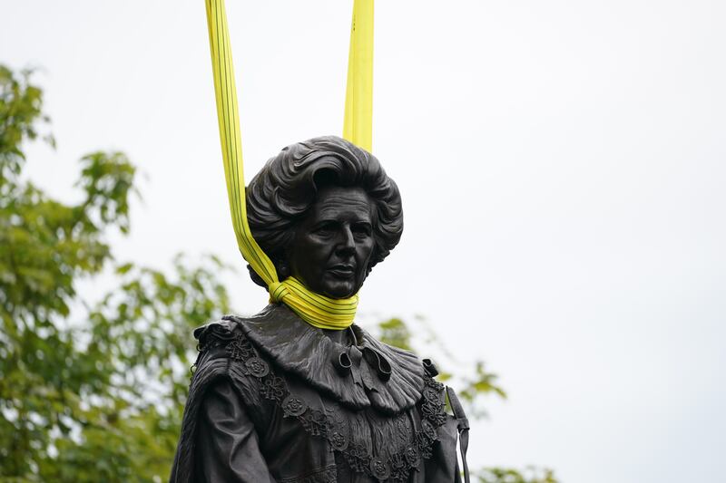 A statue of Baroness Margaret Thatcher is lowered into place in her home town of Grantham, Lincolnshire. PA