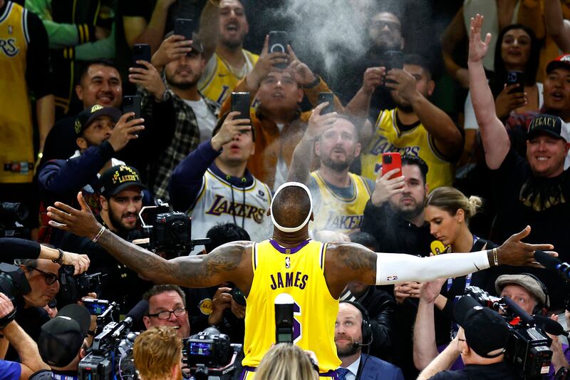 LeBron James throws chalk in the air as part of his pre-game routine. AFP