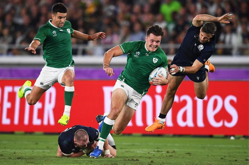 Ireland wing Jacob Stockdale, second right, runs with the ball at the International Stadium Yokohama. AFP