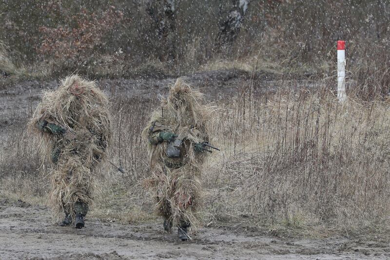 Camouflaged snipers on the move during the visit of German Minister of Defence Christine Lambrecht to the 9th Panzerlehr Brigade in Munster, northern Germany. EPA