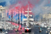 Bagpipe and sirens welcome Olympic torch to France 