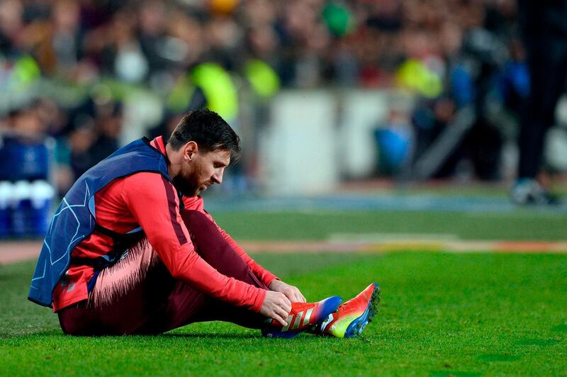 Barcelona's Argentinian forward Lionel Messi sits on the sideline. AFP