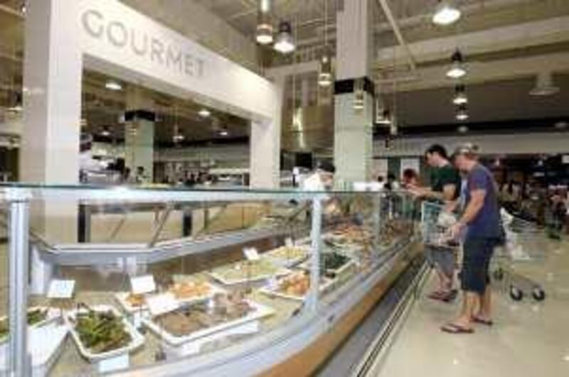 DUBAI, UNITED ARAB EMIRATES - NOVEMBER 8:  People shopping in the recently opened Waitrose supermarket at the Dubai Mall in Dubai on November 8, 2008.  (Randi Sokoloff / The National)  To go with story by James Brennan. *** Local Caption ***  RS028-1108-Waitrose.jpgRS028-1108-Waitrose.jpg RS028-1108-Waitrose.jpgRS028-1108-Waitrose.jpg