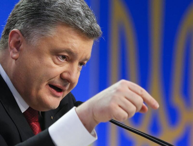 Ukrainian president Petro Poroshenko decision to move towards Nato membership has riled the country's far bigger and more powerful neighbour, Russia. Photo: Sergey Dolzhenko / EPA