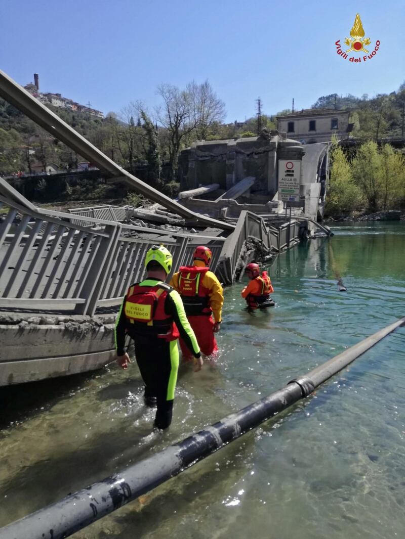 A handout photo made available by Vigili del Fuoco, Italy's National Firefighters Corps, shows the collapsed bridge on a provincial road between Santo Stefano Magra and Albiano, in the municipality of Aulla, Massa-Carrara province, Tuscany, Italy.  EPA