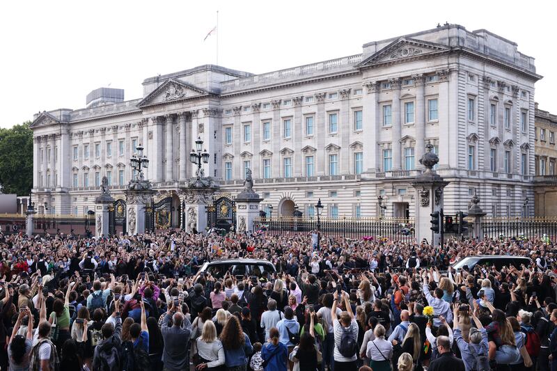 The car carrying King Charles and the queen consort arrives at Buckingham Palace with the Union Flag at half mast. Getty Images