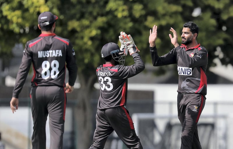 DUBAI, UNITED ARAB EMIRATES , Dec 12– 2019 :- Ahmed Raza of UAE ( right ) celebrating after taking the wicket of Aaron Jones during the World Cup League 2 cricket match between UAE vs USA held at ICC academy in Dubai. ( Pawan Singh / The National )  For Sports. Story by Paul