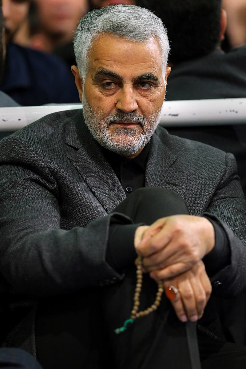 (FILES) This file  handout photo released on March 27, 2015 by the official website of the Centre for Preserving and Publishing the Works of Iran's supreme leader, shows the commander of the Iranian Revolutionary Guard's Quds Force, Gen. Qassem Soleimani, attending a religious ceremony in Tehran to commemorate the anniversary of the death of the daughter of Prophet Mohammed.  Top Iranian commander Qasem Soleimani was killed in a US strike on Baghdad's international airport on January 3, 2019, Iraq's powerful Hashed al-Shaabi paramilitary force has said, in a dramatic escalation of tensions between Washington and Tehran. / AFP / KHAMENEI.IR / -
