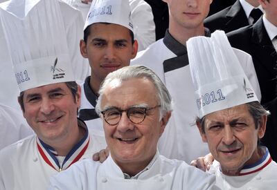 Alain Ducasse (centre), Michel Roth (L) and Jacques Maximin pose during the finals for the prestigious Meilleur Ouvrier de France (MOF) title outside the hotel management school in Marseille, southern France on May 5, 2011. AFP