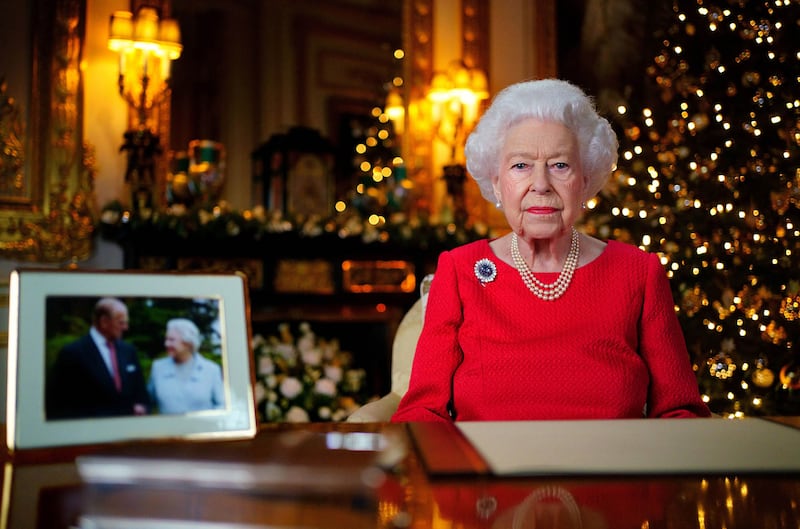 Queen Elizabeth II records her annual Christmas broadcast in the White Drawing Room in Windsor Castle. She is seen wearing the chrysanthemum sapphire brooch in tribute to her late husband. Getty Images