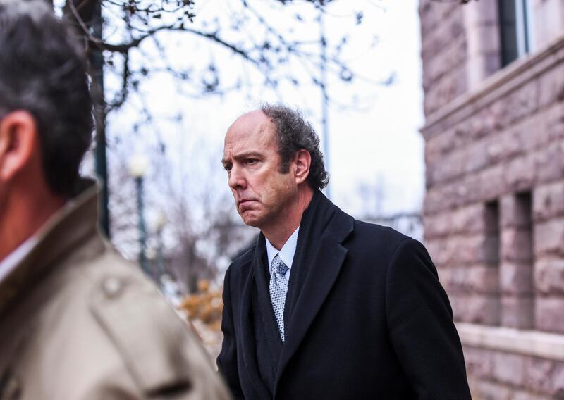 Paul Erickson leaves the federal courthouse on Tuesday, Nov. 26, 2019, in Sioux Falls, S.D. Erickson pleaded guilty to one charge of wire fraud and one charge of money laundering in a fraud scheme that authorities said bilked at least $2.3 million from 78 people.  (Abigail Dollins/The Argus Leader via AP)