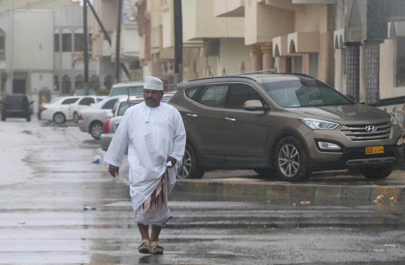 An Omani man walks down the street. Kamran Jebreili / AP Photo