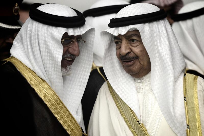 Bahrain's Prime Minister Sheikh Khalifa bin Salman Al-Khalifa (R) speaks to an unidentified man as he attends the opening ceremony of the Bahrain National Theatre in capital Manama on November 12, 2012. AFP PHOTO/MOHAMMED AL-SHAIKH (Photo by MOHAMMED AL-SHAIKH / AFP)