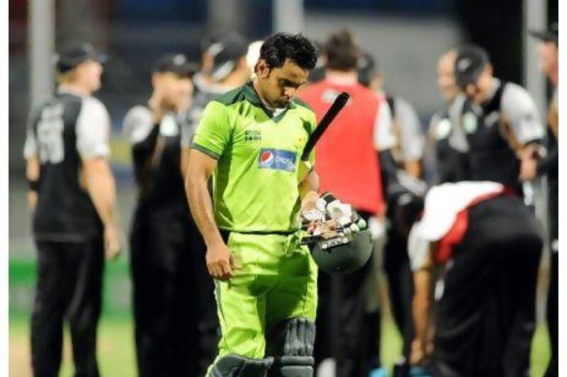 Pakistan’s Mohammed Hafeez walks after being run out by New Zealand for 46 in the second Twenty20 match in Hamilton yesterday. Hafeez scored 46 but without much support from the other batsmen.