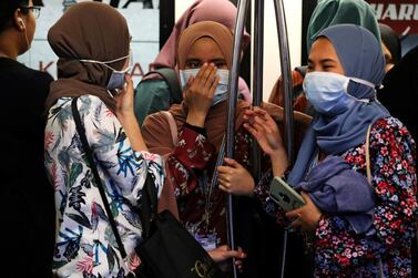 Passengers wear masks to prevent the outbreak of a new coronavirus in a Light Rail Transit train in Kuala Lumpur, Malaysia. Reuters