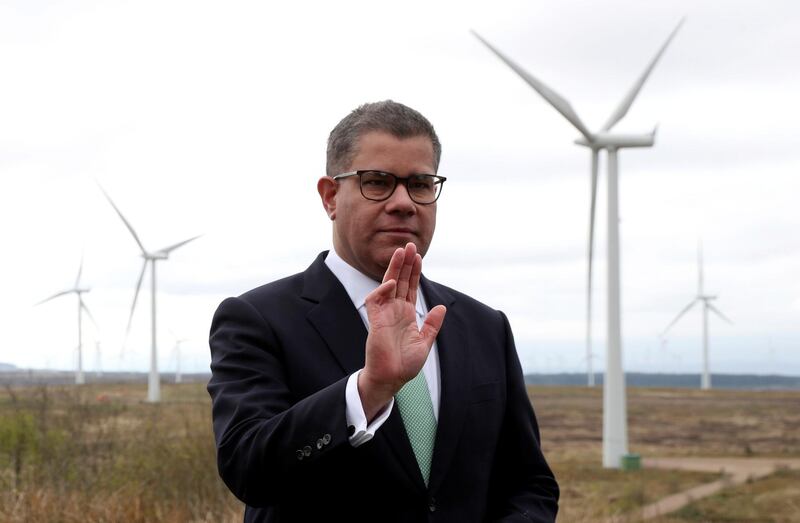 FILE PHOTO: FILE PHOTO: COP26 President Alok Sharma rehearses a speech at Whitelee Windfarm, with six months to go until the U.N. Climate Change Conference, just outside Glasgow, Scotland, Britain, May 14, 2021. REUTERS/Russell Cheyne/Pool/File Photo