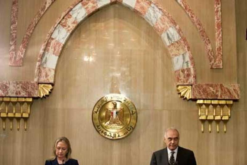 Egyptian Foreign Minister Mohammed Kamel Amr, right, holds a joint press conference with US Secretary of State Hillary Clinton in Cairo.