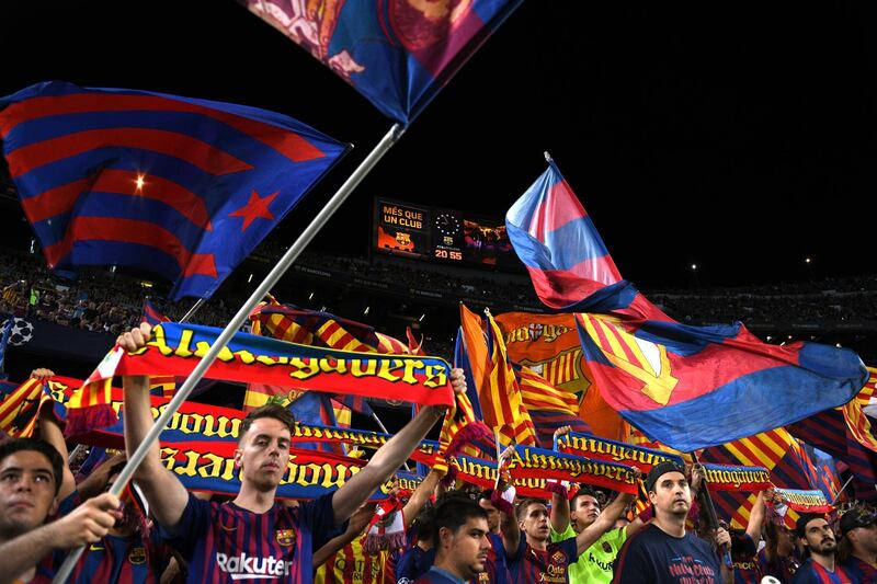 Fans show their support during the match. Getty Images