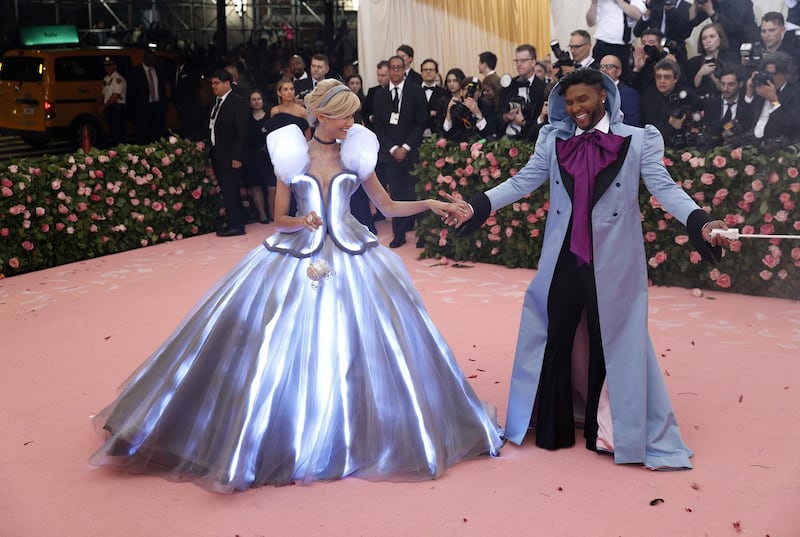 While the world was going crazy for Zendaya's light up Cinderella gown, somehow everyone overlooked that Law Roach wore a lavender hooded coat, with magenta cravat. EPA