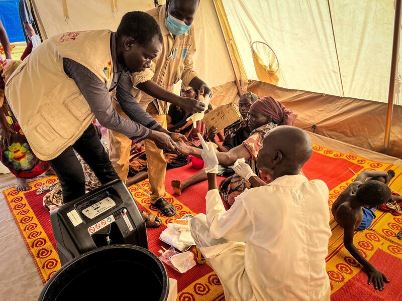 Wounded Sudanese refugees who fled conflict in West Darfur receive medical support from Doctors Without Borders and health ministry staff at a hospital in Adre, Chad, on June 16. Reuters