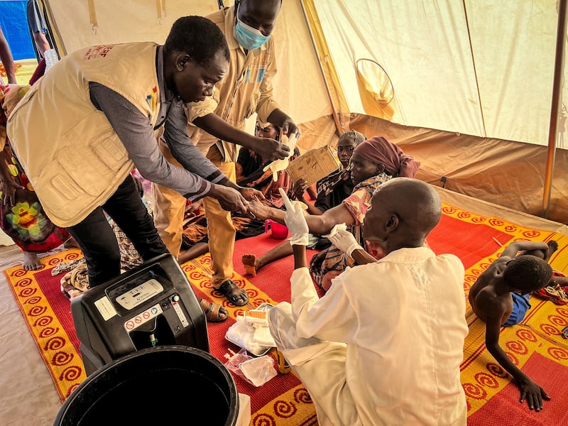 Wounded Sudanese refugees who fled conflict in West Darfur receive medical support from Doctors Without Borders and health ministry staff at a hospital in Adre, Chad, on June 16. Reuters