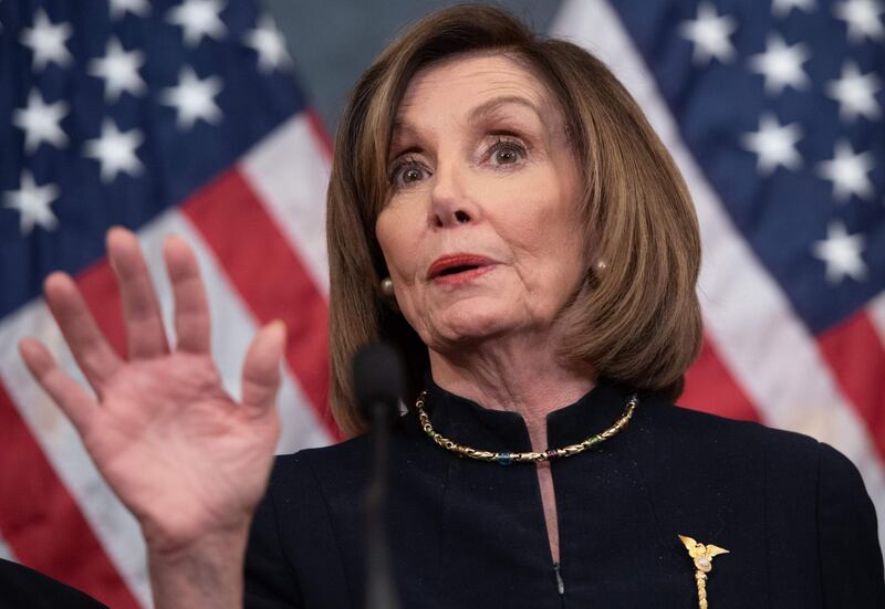 (FILES) In this file photo taken on December 18, 2019 US Speaker of the House Nancy Pelosi holds a press conference after the House passed Resolution 755, Articles of Impeachment Against President Donald J. Trump, at the US Capitol in Washington, DC. House speaker Nancy Pelosi said December 23, 2019 that she is not yet ready to name her team for President Donald Trump's trial in the US Senate on charges of abuse of power and obstruction of Congress. / AFP / SAUL LOEB

