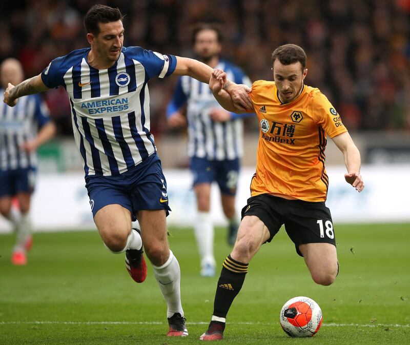 Brighton's Lewis Dunk (left) battles for the ball against Wolves during the 0-0 draw at Molineux. PA