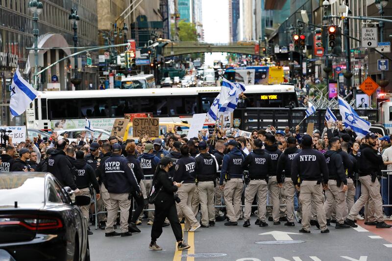 New York City Police hold back Israeli supporters during a protest between Palestinian and Israeli demonstrators. EPA