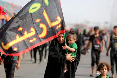 Shiite Muslim pilgrims walk on the outskirts of the Iraqi capital Baghdad towards the southern Iraqi city of Karbala on October 24, 2018. AFP