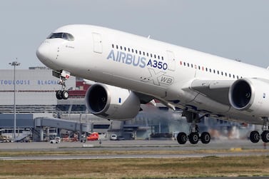 An Airbus A350 takes off at the aircraft builder's headquarters in Colomiers near Toulouse, France. The company won approval from its board for a new 15 billion euros (Dh59.1bn) credit facility. Reuters